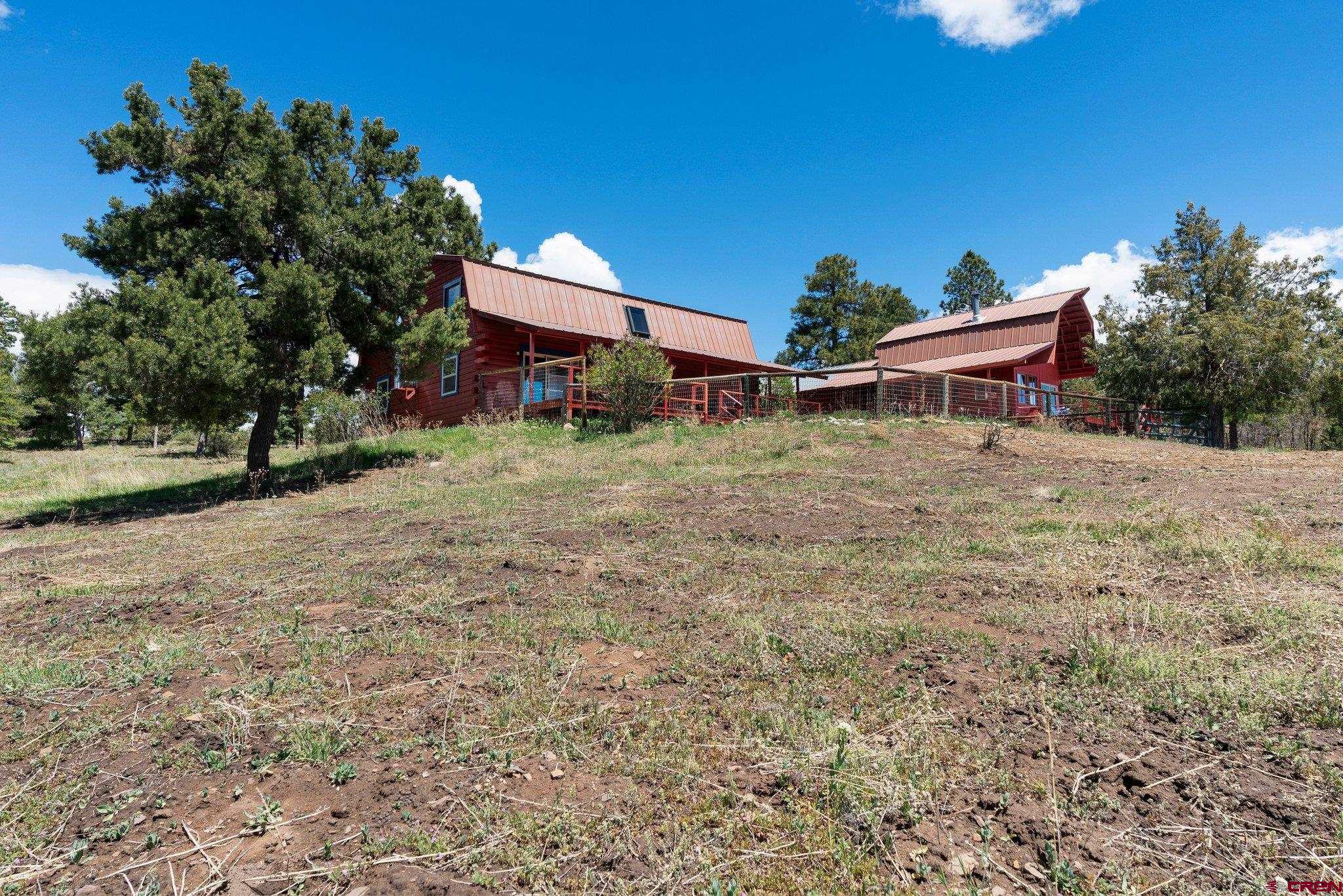 340 Ridge Road Durango, CO 81303 - Photo 32 of 35 a front view of a house with a yard