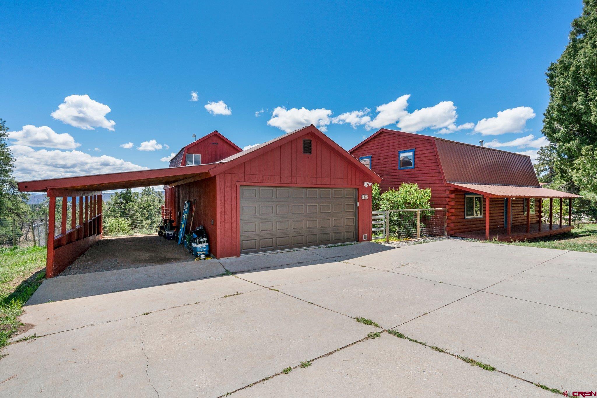 340 Ridge Road Durango, CO 81303 - Photo 33 of 35 a front view of a house with a yard and garage