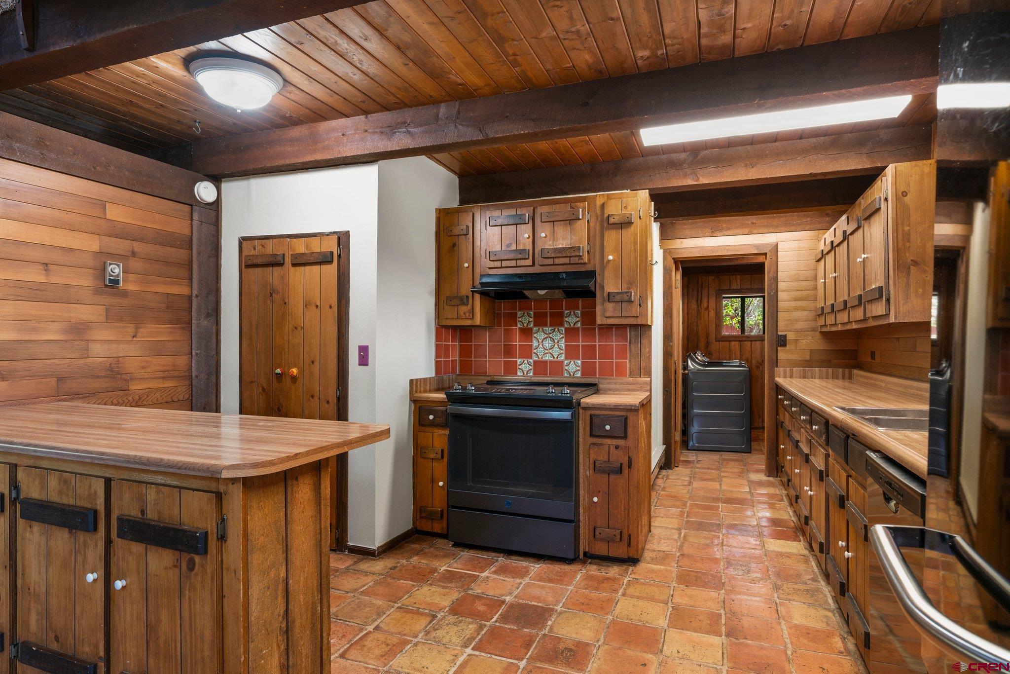 340 Ridge Road Durango, CO 81303 - Photo 6 of 35 a kitchen with stainless steel appliances granite countertop a stove and a refrigerator