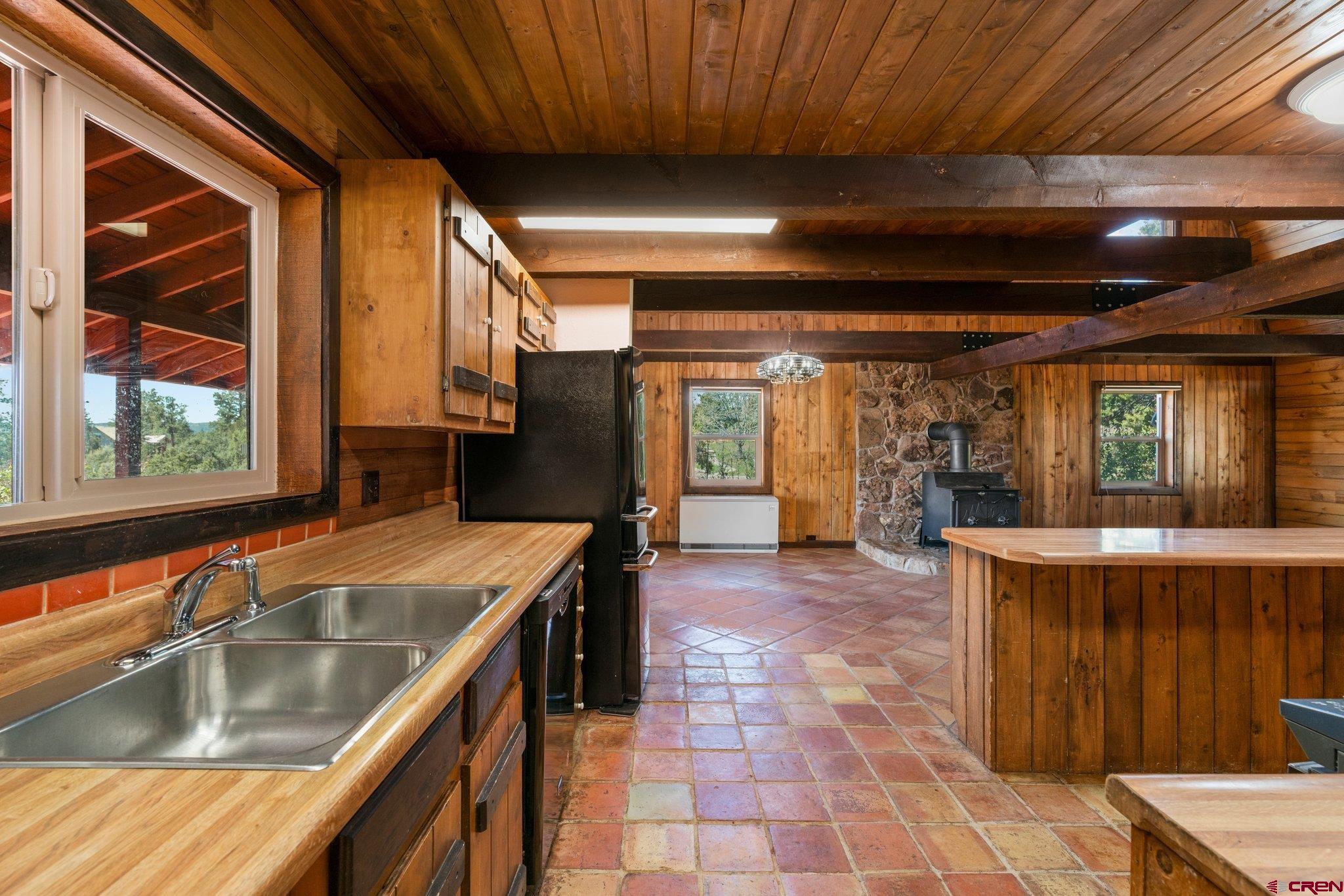 340 Ridge Road Durango, CO 81303 - Photo 8 of 35 a kitchen with a sink and large windows