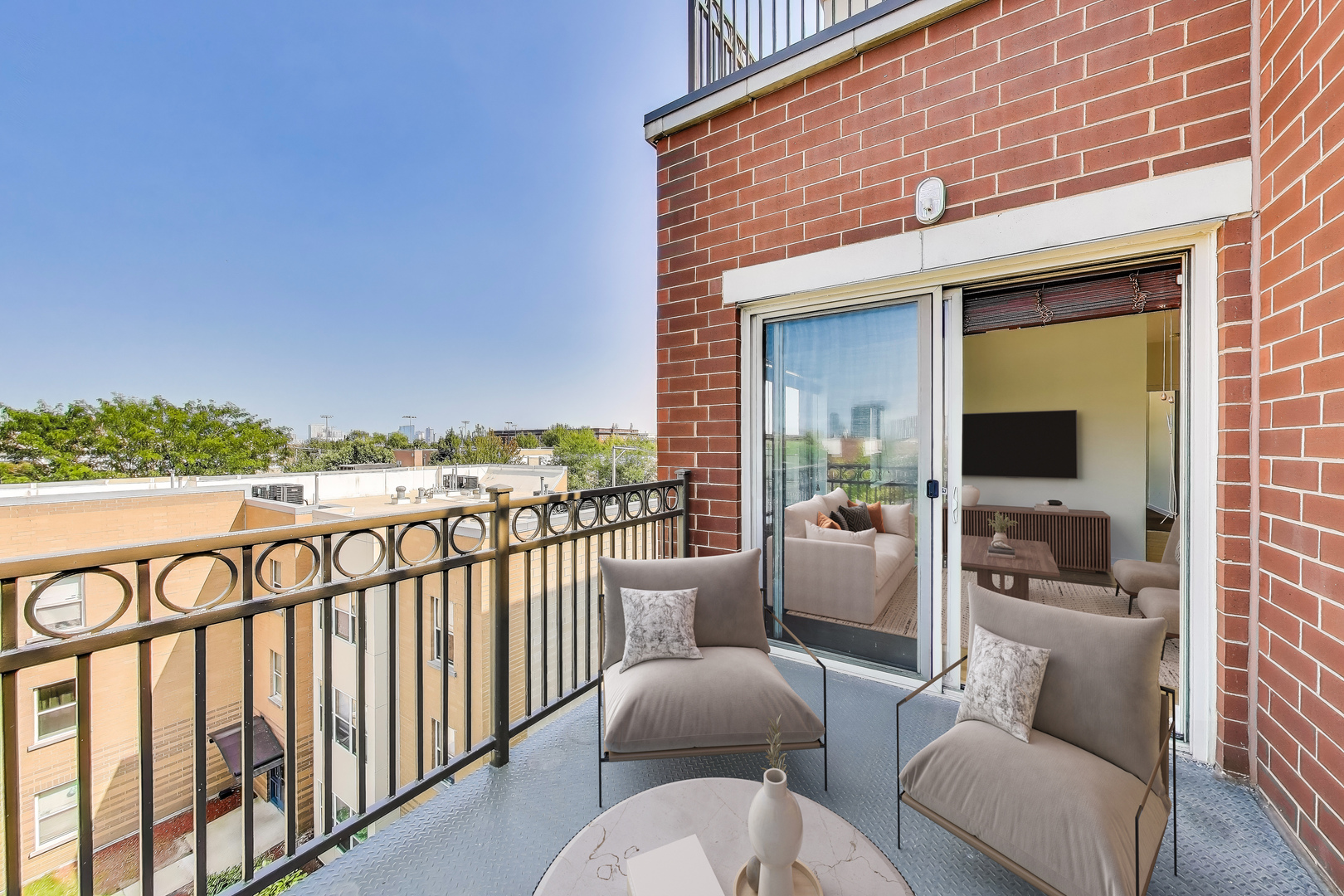 1155 West Roosevelt Road, Unit 412 Chicago, IL 60608 - Photo 14 of 31 a balcony with furniture and a potted plant