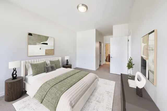 a bedroom with a bed and a couch