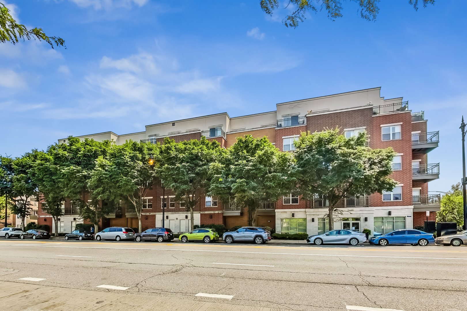 1155 West Roosevelt Road, Unit 412 Chicago, IL 60608 - Photo 2 of 31 front view of a building with a street
