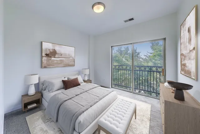 a bedroom with a bed and a large window