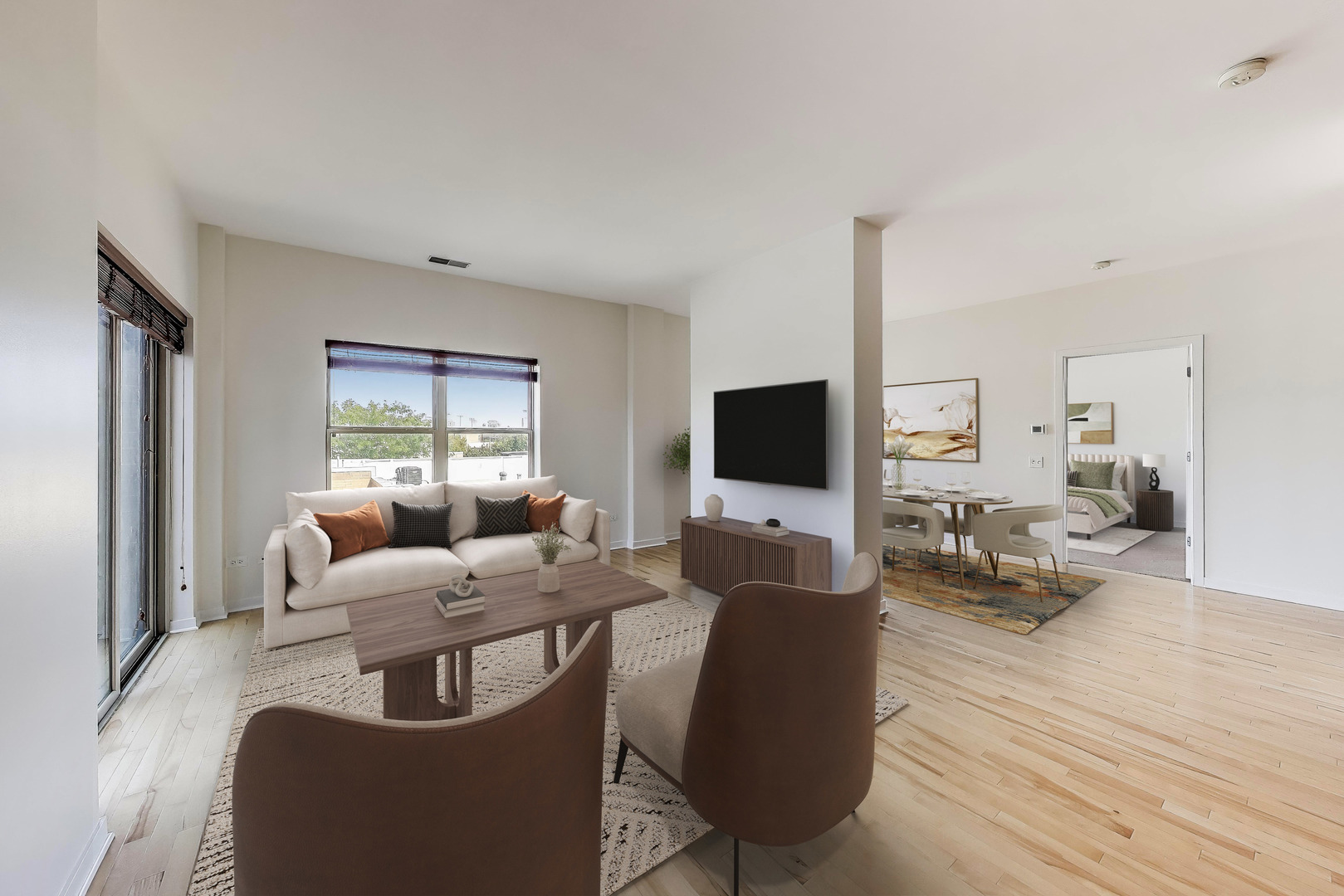 1155 West Roosevelt Road, Unit 412 Chicago, IL 60608 - Photo 6 of 31 a living room with furniture and a flat screen tv