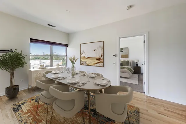 a dining room with furniture and window