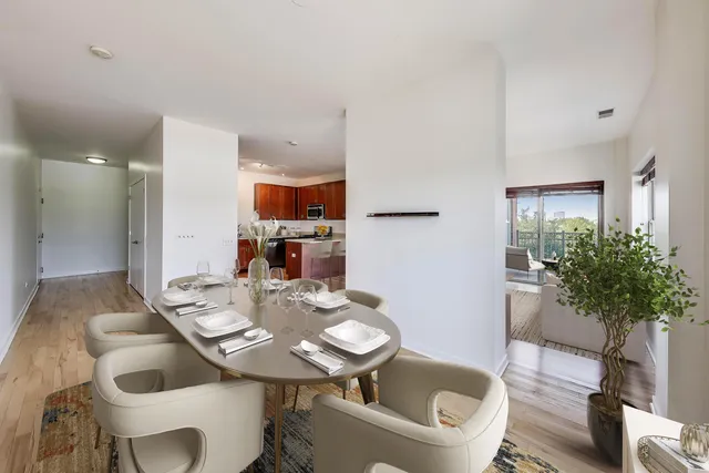 a view of a dining room with furniture and wooden floor