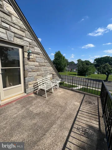 a view of a wooden deck with a bench