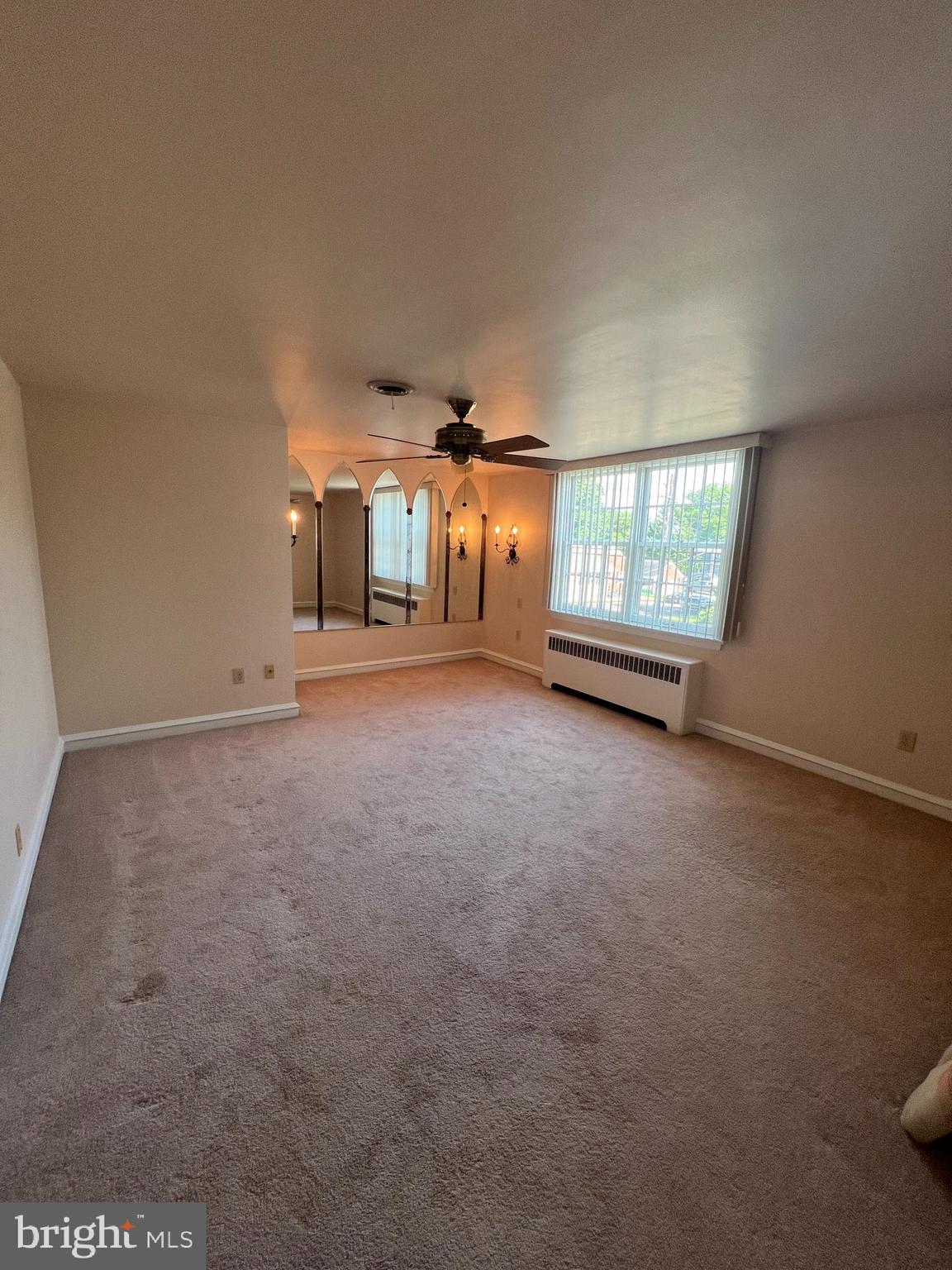 415 East Main Street, Unit A Maple Shade, NJ 08052 - Photo 15 of 41 an empty room with windows and ceiling fan