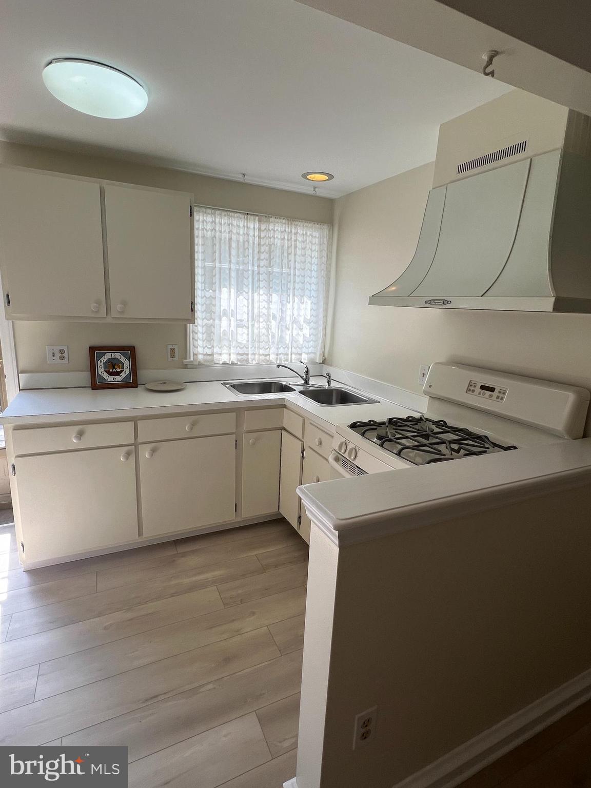 415 East Main Street, Unit A Maple Shade, NJ 08052 - Photo 23 of 41 a white kitchen with a stove top oven