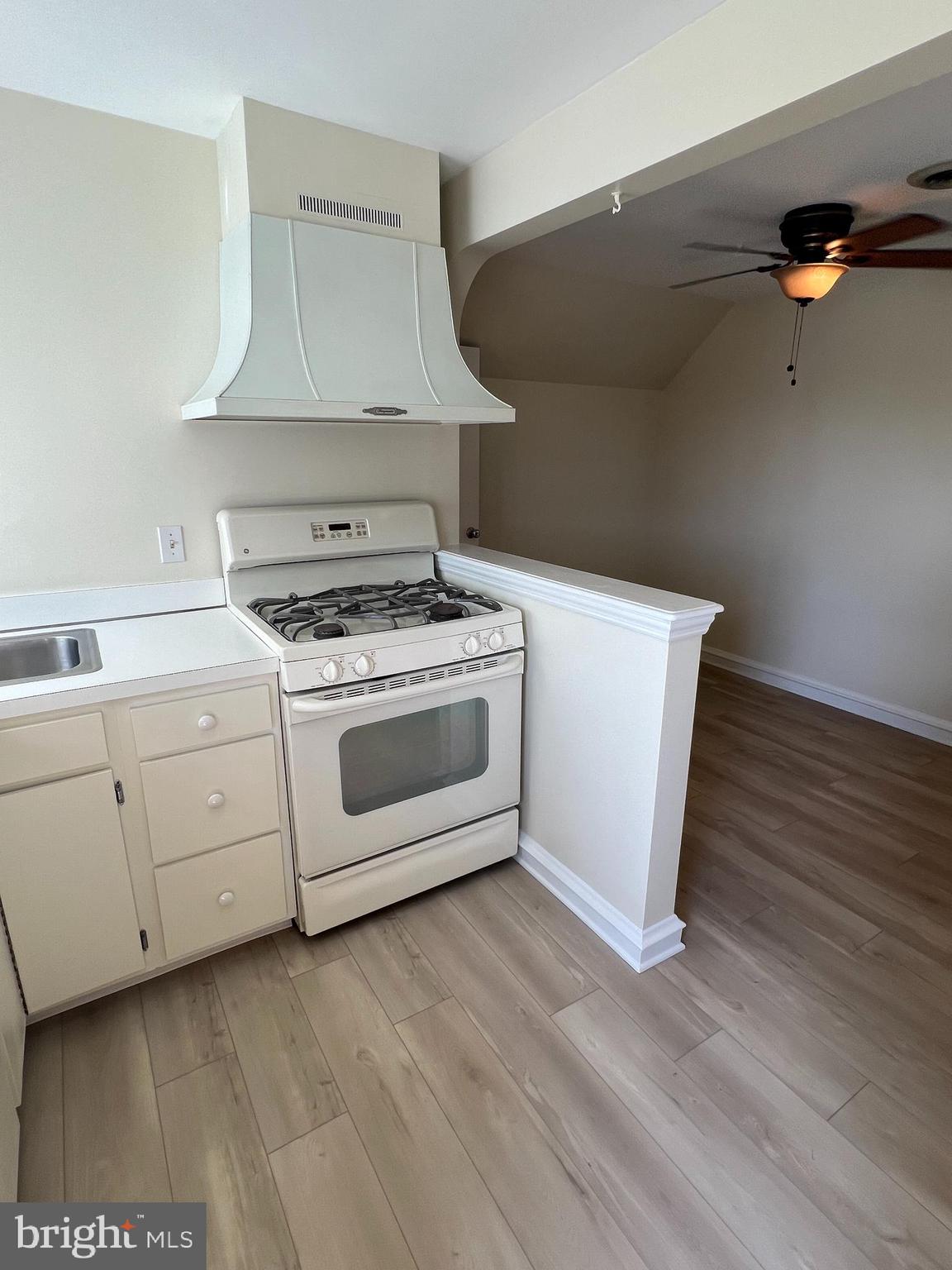 415 East Main Street, Unit A Maple Shade, NJ 08052 - Photo 24 of 41 a white stove top oven sitting inside of a kitchen