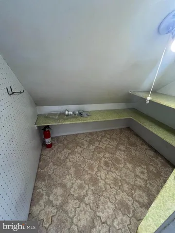 a view of a kitchen with a sink cabinets and wooden floor