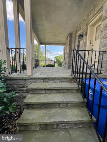 a view of a backyard with potted plants
