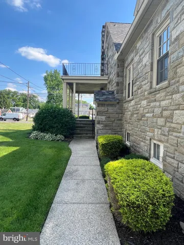 a view of yard with beautiful flowers and green space
