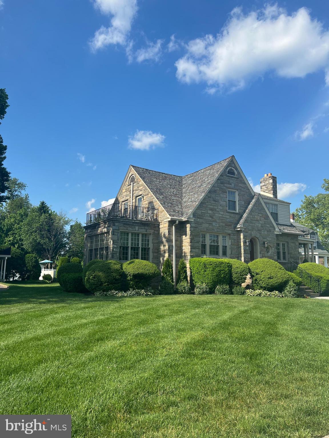 415 East Main Street, Unit A Maple Shade, NJ 08052 - Photo 4 of 41 a view of a big yard in front of a brick house with large windows