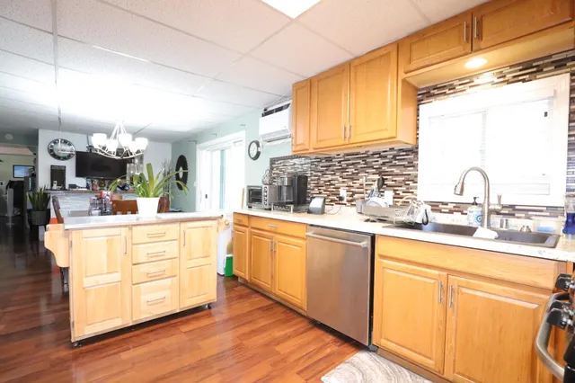 a kitchen with stainless steel appliances sink and white cabinets