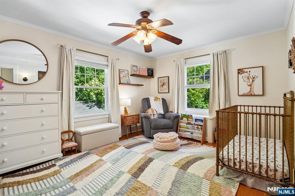 72 Central Avenue Montclair, NJ 07042 - Photo 19 of 36 a bedroom with a bed and wooden floor