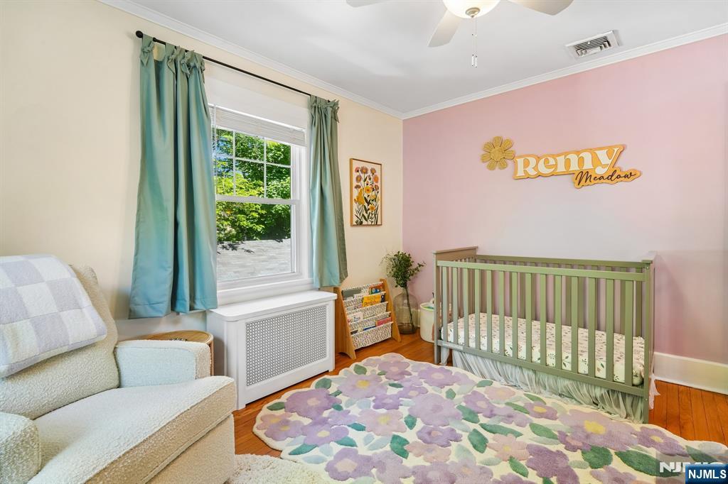 72 Central Avenue Montclair, NJ 07042 - Photo 21 of 36 a bedroom with a bed and a window