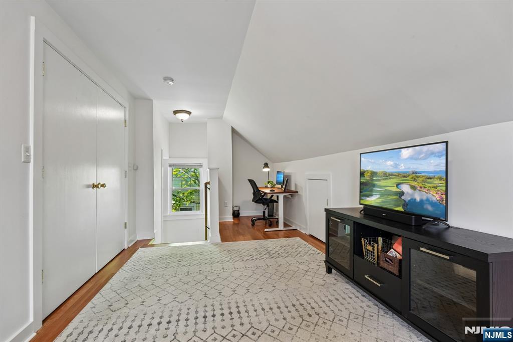 72 Central Avenue Montclair, NJ 07042 - Photo 28 of 36 a view of a livingroom with furniture and a flat screen tv