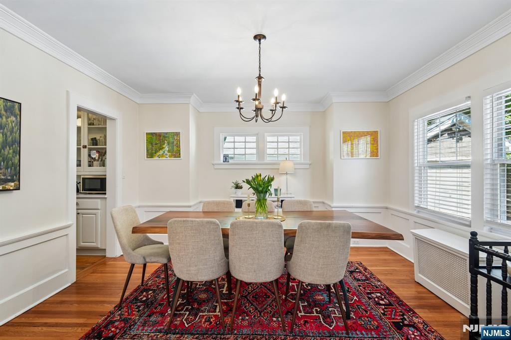 72 Central Avenue Montclair, NJ 07042 - Photo 9 of 36 a dining room with furniture a chandelier and wooden floor