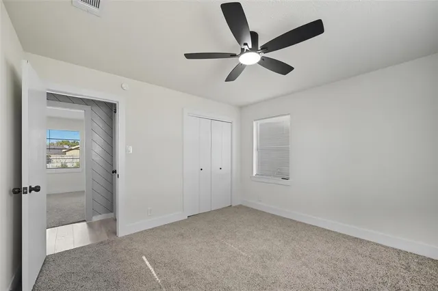 a view of a livingroom with a ceiling fan
