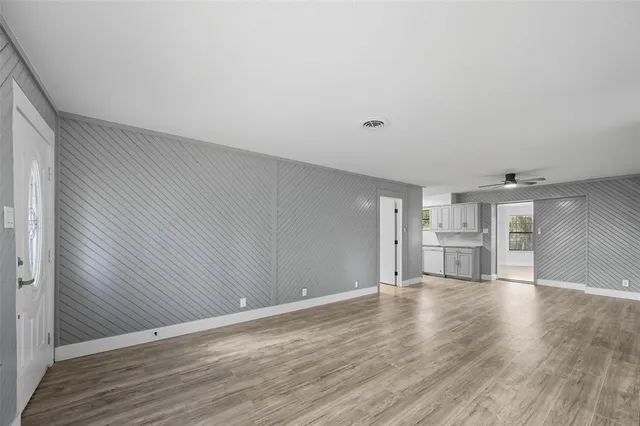 a view of a kitchen with wooden floor