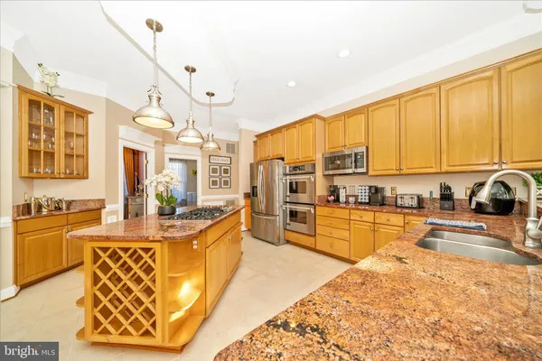 a living room with furniture and a view of kitchen