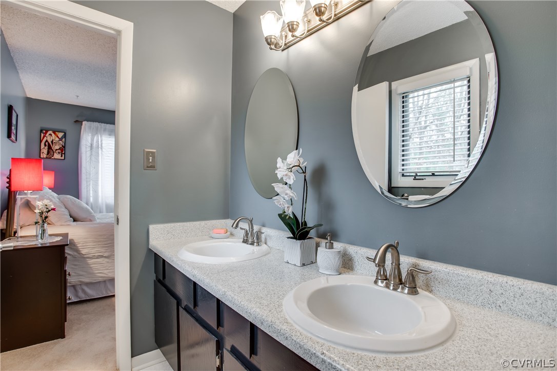 14208 Regatta Pointe Road Midlothian, VA 23112 - Photo 20 of 35 a bathroom with a sink and a mirror