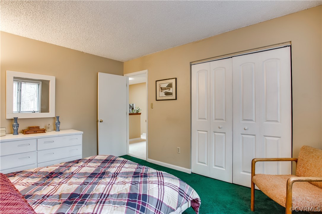 14208 Regatta Pointe Road Midlothian, VA 23112 - Photo 23 of 35 a bedroom with a bed and a view of bathroom