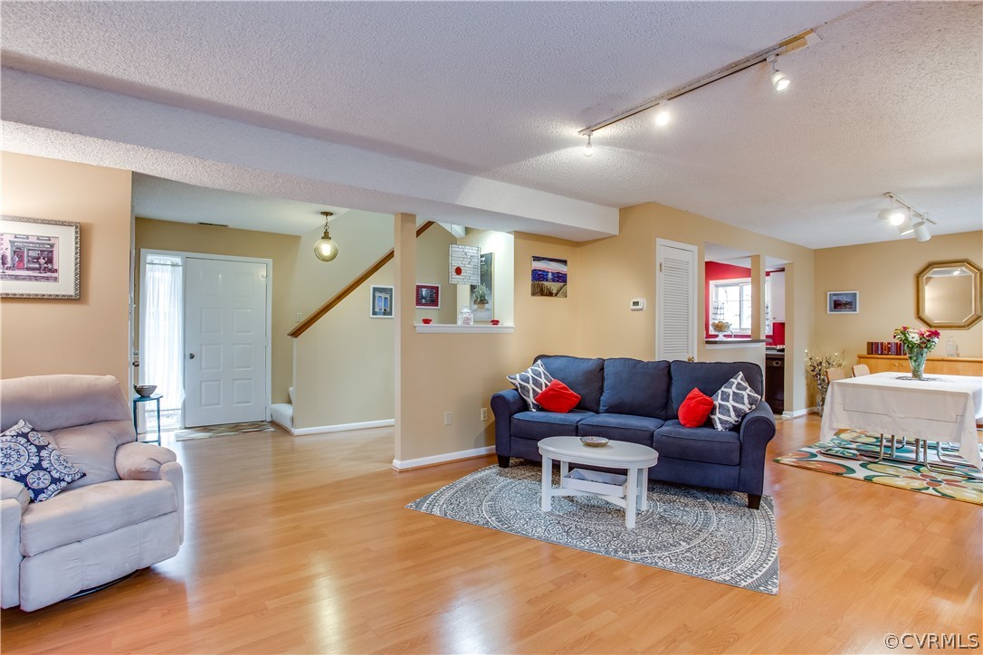 14208 Regatta Pointe Road Midlothian, VA 23112 - Photo 7 of 35 a living room with furniture and wooden floor