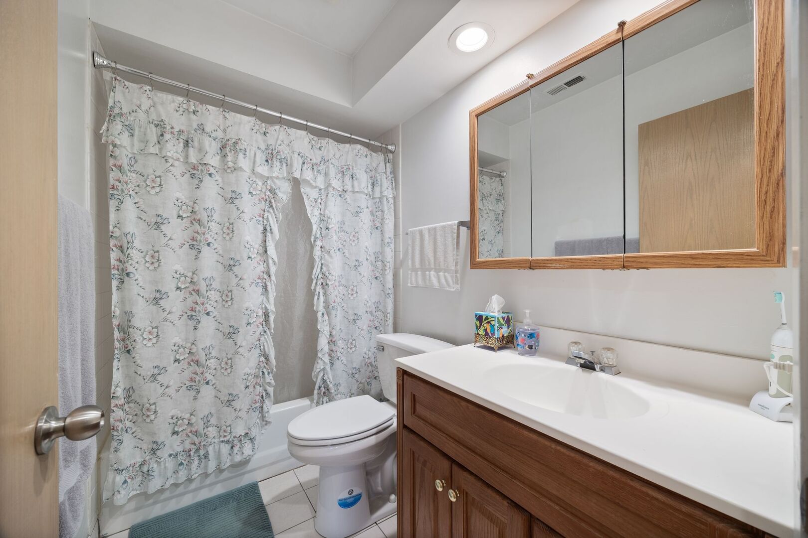 701 Garth Road Wheeling, IL 60090 - Photo 18 of 23 a bathroom with a sink toilet and shower