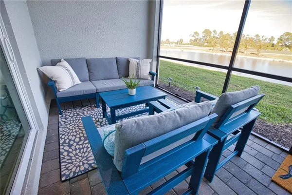 a living room with furniture and a window