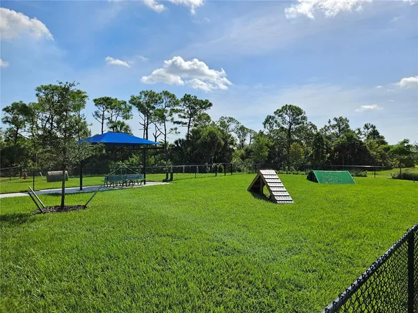 a view of a park with a slide