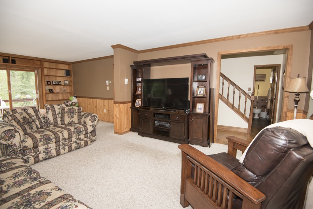 245 Stafford Road Holland, MA 01521 - Photo 23 of 30 a living room with furniture and a flat screen tv