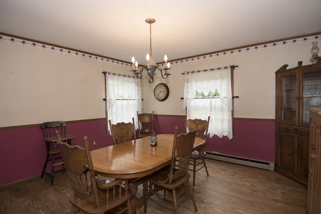 245 Stafford Road Holland, MA 01521 - Photo 10 of 30 a view of a dining room with furniture and chandelier