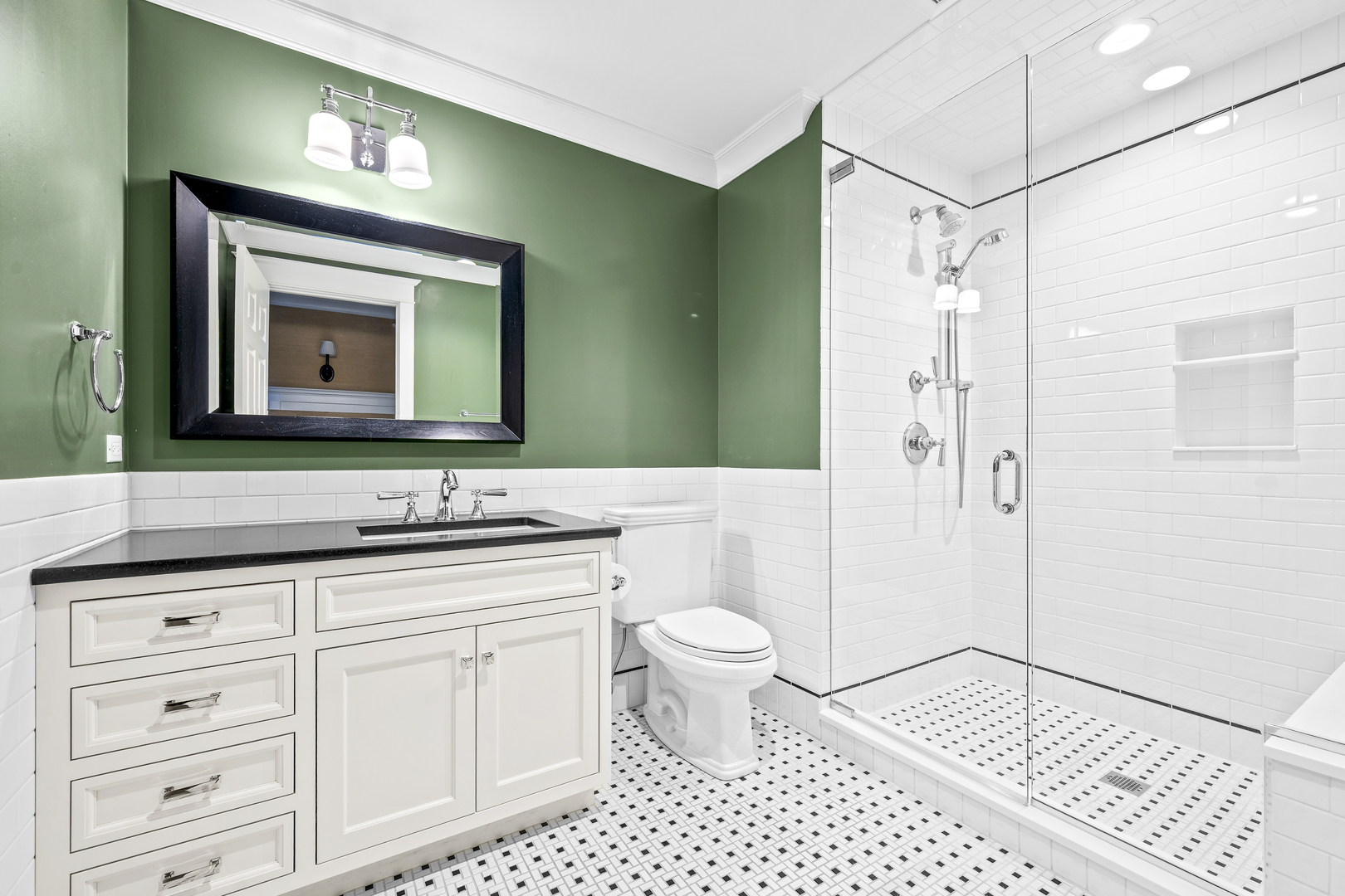 140 Birch Street Winnetka, IL 60093 - Photo 52 of 78 a bathroom with a toilet a sink a mirror and shower