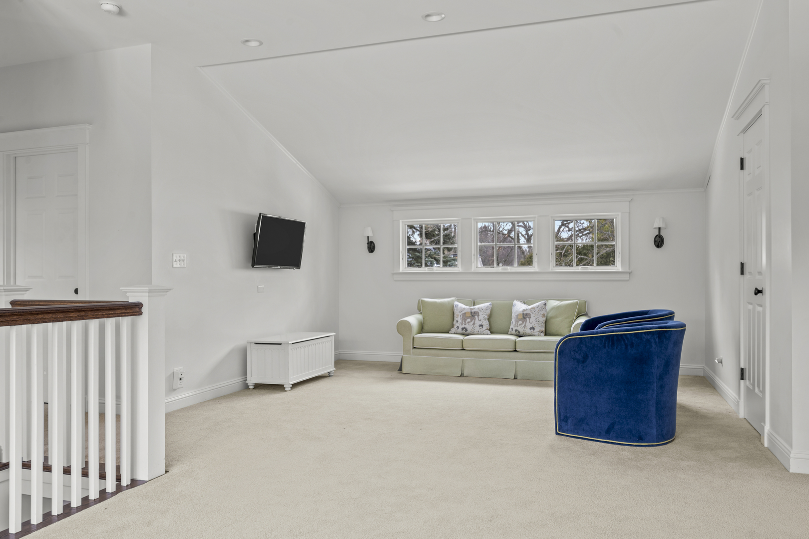 140 Birch Street Winnetka, IL 60093 - Photo 56 of 78 a living room with furniture and a flat screen tv