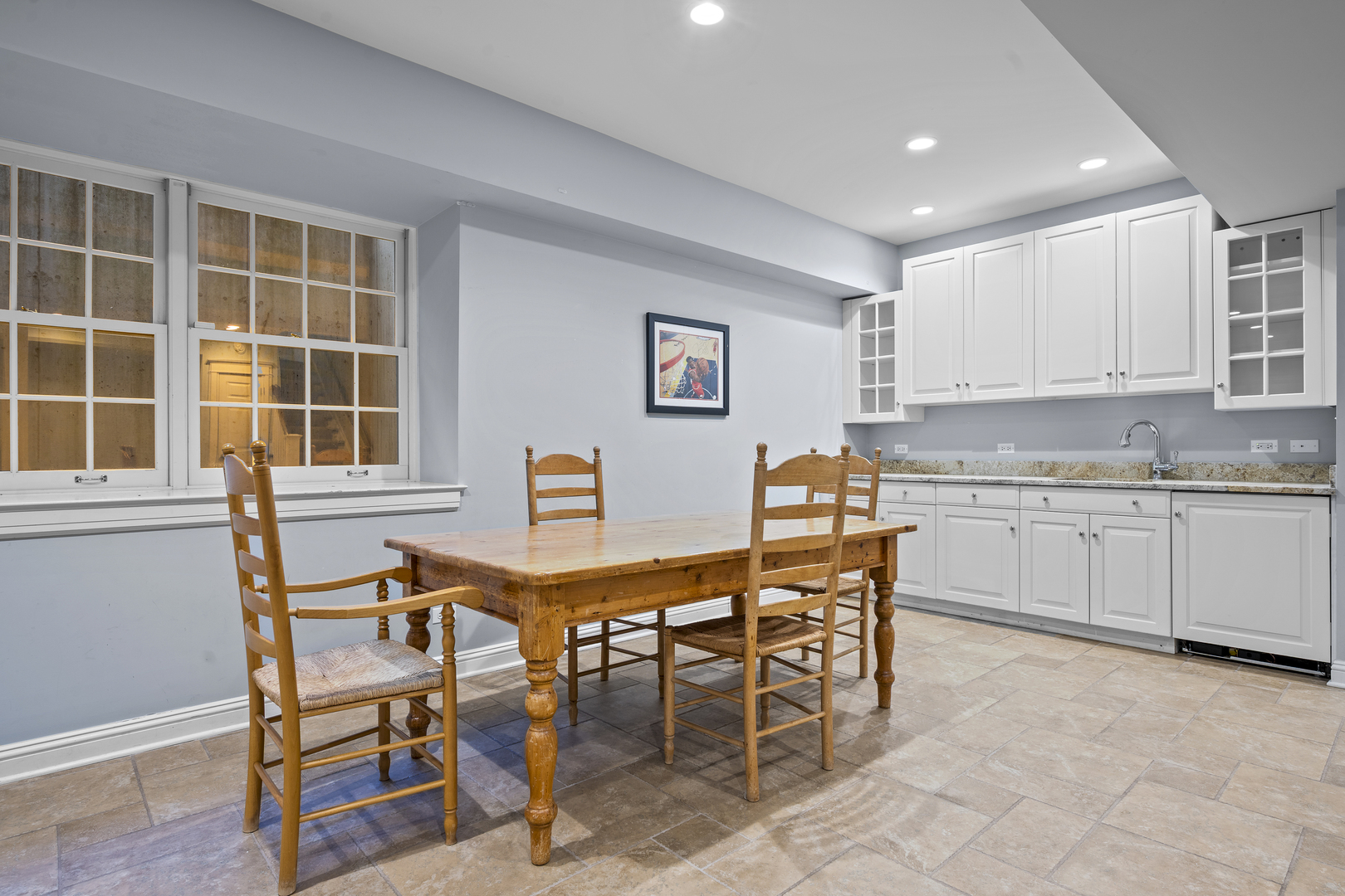 140 Birch Street Winnetka, IL 60093 - Photo 65 of 78 a view of a dining room with furniture and a kitchen