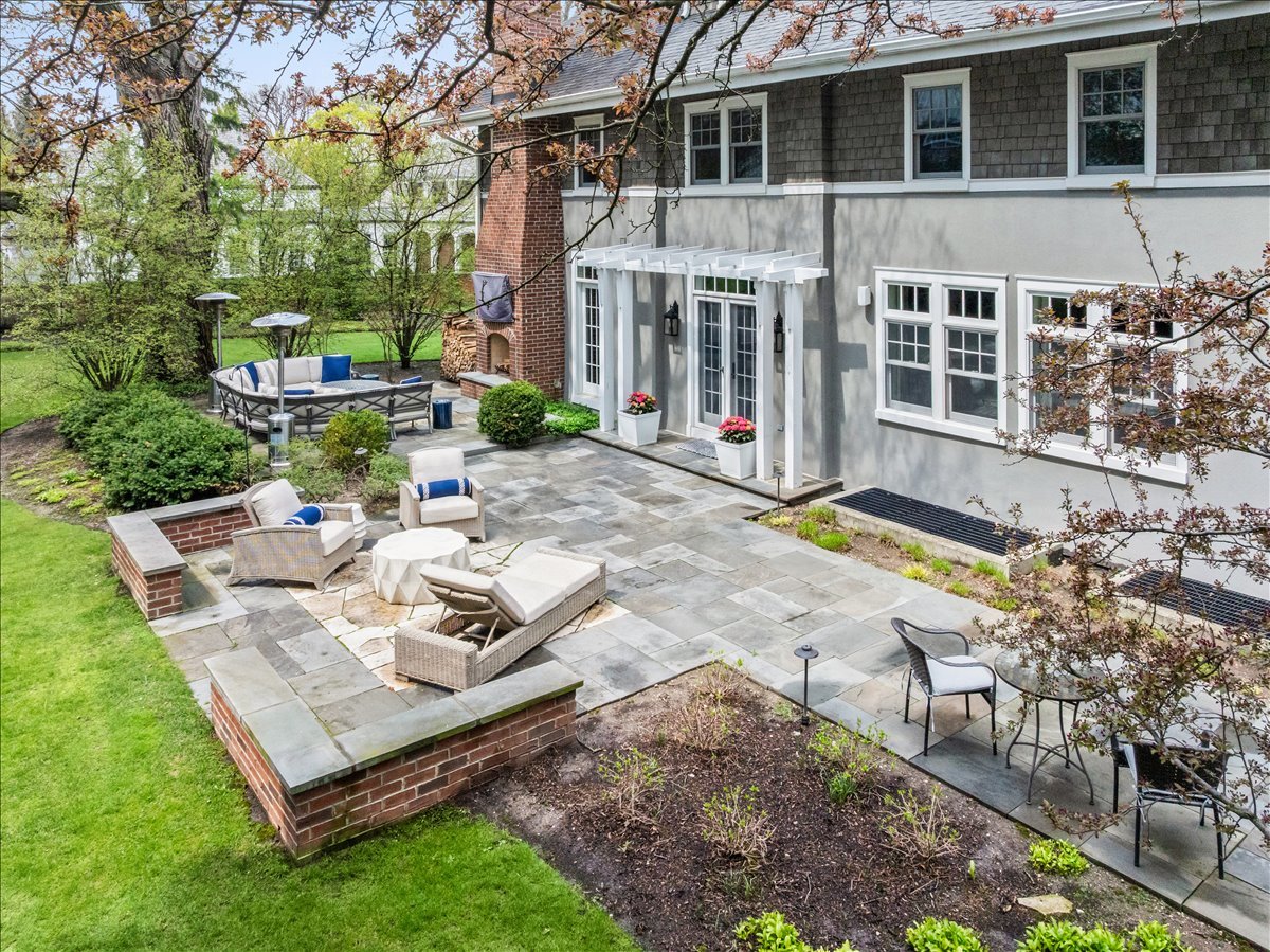 140 Birch Street Winnetka, IL 60093 - Photo 77 of 78 a view of a house with backyard sitting area and garden