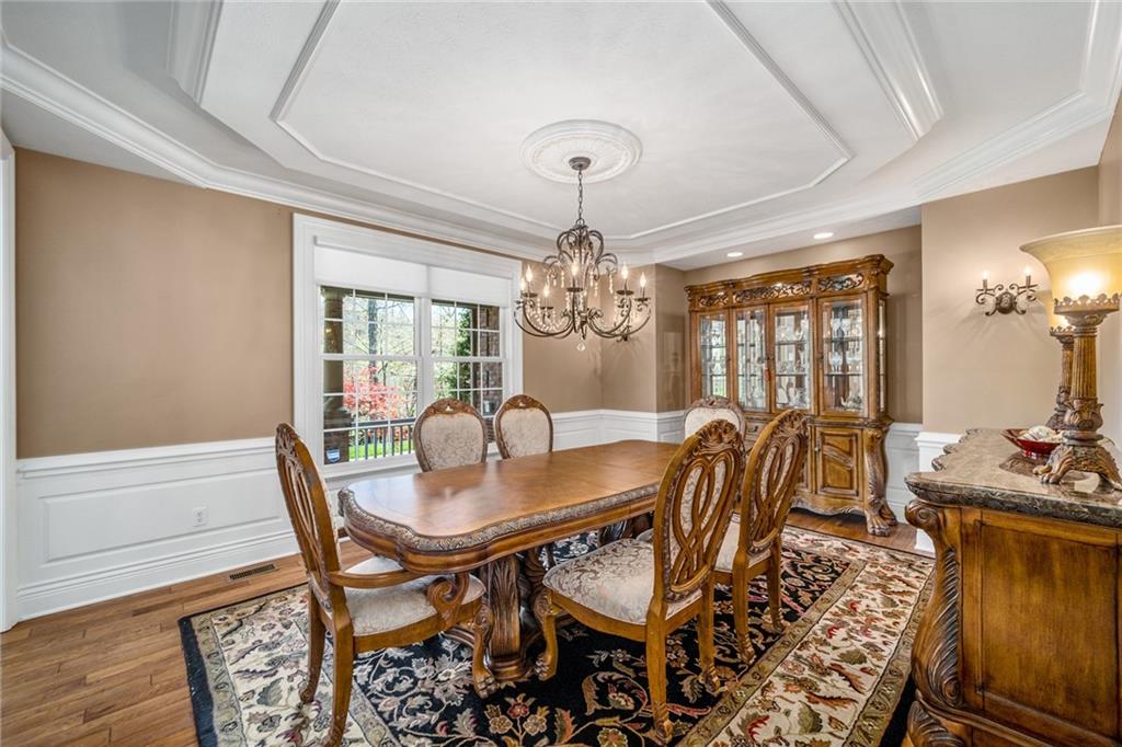 248 Hespenheide Road Mars, PA 16046 - Photo 11 of 25 a dining room with furniture a chandelier and wooden floor