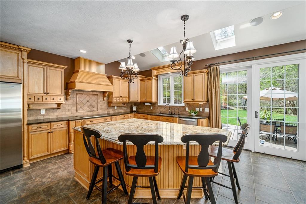 248 Hespenheide Road Mars, PA 16046 - Photo 12 of 25 a dining table with chairs and kitchen view