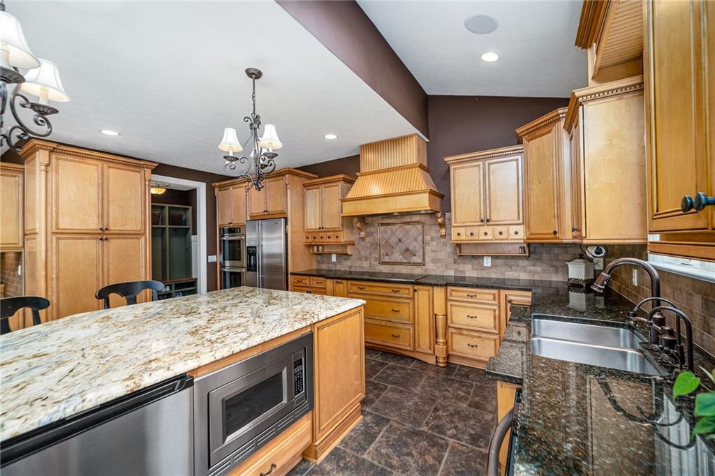 248 Hespenheide Road Mars, PA 16046 - Photo 13 of 25 a kitchen with stainless steel appliances granite countertop sink stove and refrigerator