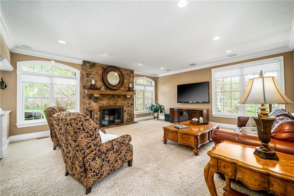 248 Hespenheide Road Mars, PA 16046 - Photo 15 of 25 a living room with furniture flat screen tv and a fireplace