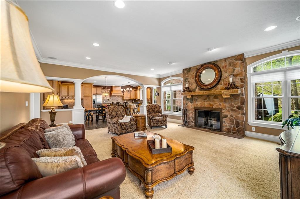 248 Hespenheide Road Mars, PA 16046 - Photo 16 of 25 a living room with furniture a fireplace and a large window