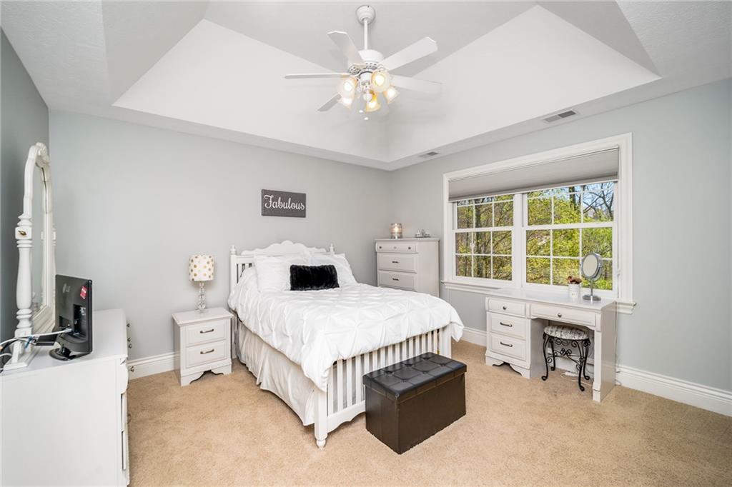 248 Hespenheide Road Mars, PA 16046 - Photo 21 of 25 a spacious bedroom with a bed and a table in it