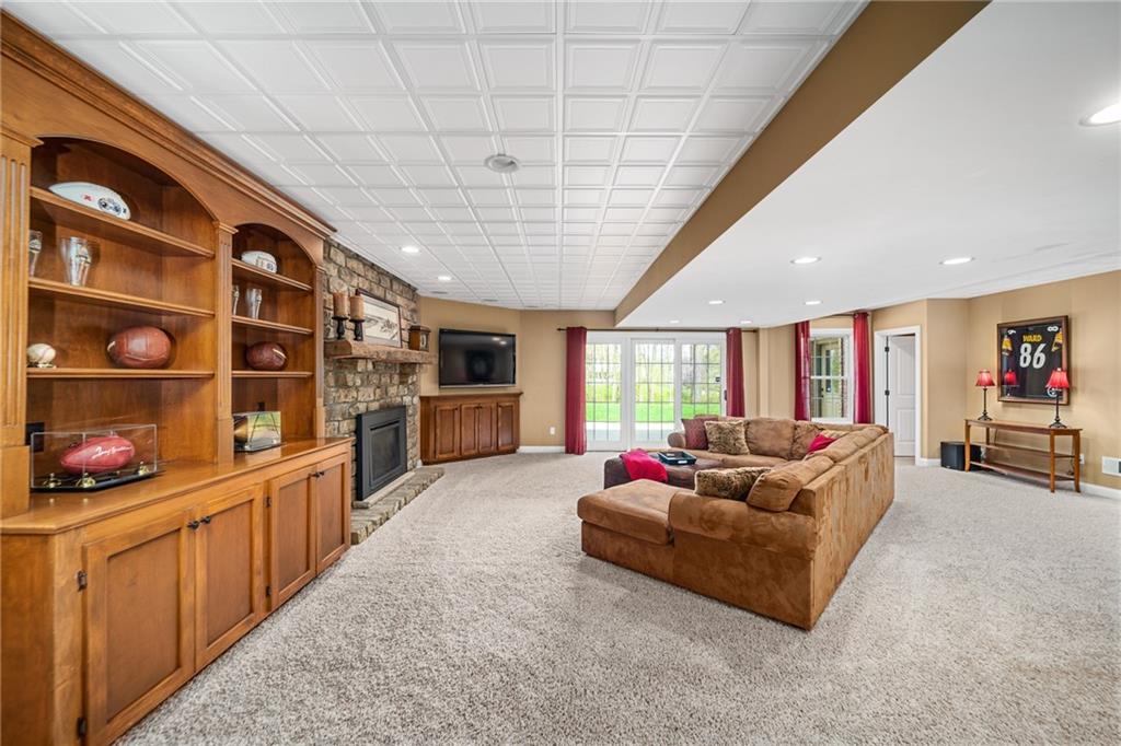 248 Hespenheide Road Mars, PA 16046 - Photo 22 of 25 a living room with furniture fireplace and flat screen tv