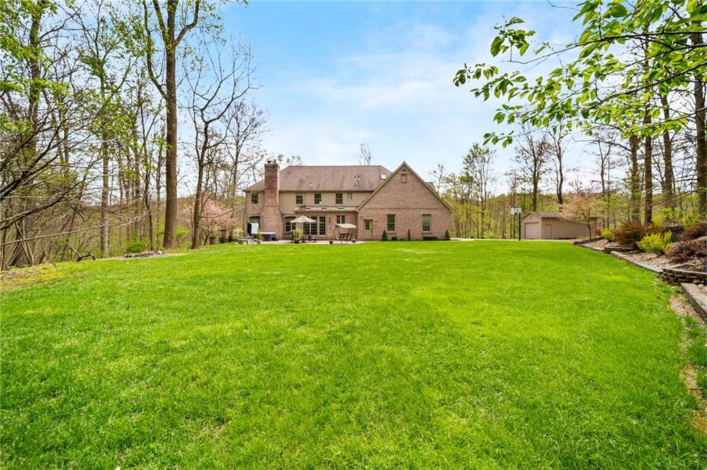 248 Hespenheide Road Mars, PA 16046 - Photo 6 of 25 a view of a house with a big yard and large trees
