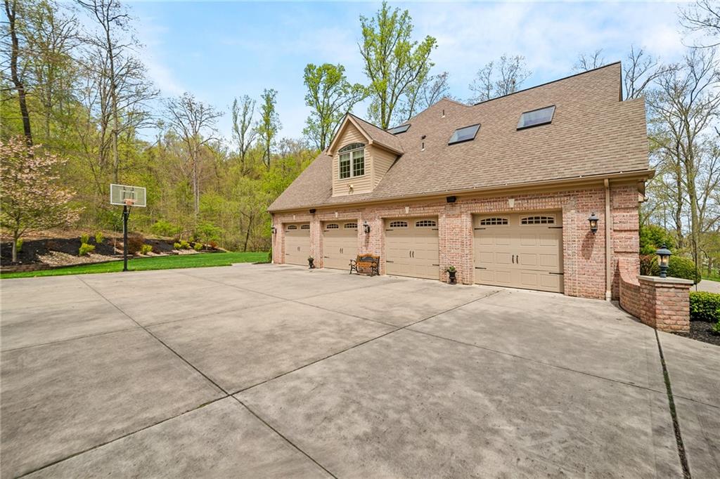 248 Hespenheide Road Mars, PA 16046 - Photo 7 of 25 a front view of a house with a yard and garage