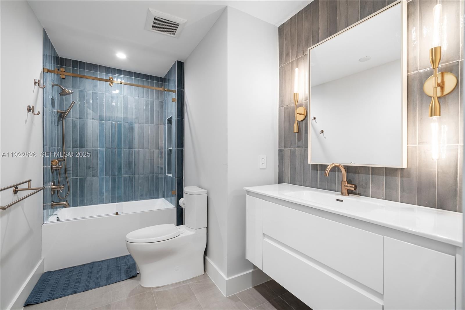 7220 Southwest 107th Terrace Pinecrest, FL 33156 - Photo 14 of 24 a bathroom with a sink toilet and shower