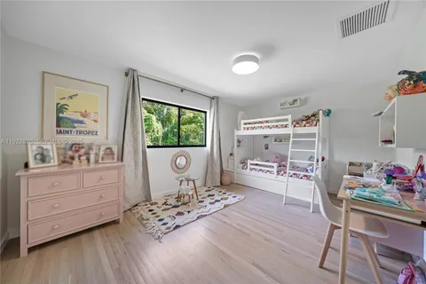a living room with furniture and flat screen tv
